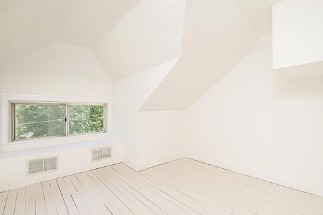 Attic transformation — bright finished room with window