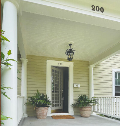 Colonial façade restoration — front porch, columns, and entry door