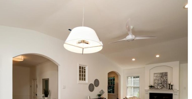 Finished living room with pendant light and ceiling fan