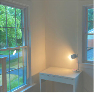 Architectural Foundation — window, desk, and lamp in a bright children's room