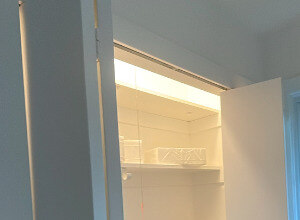Architectural Refresh — open closet with white shelving